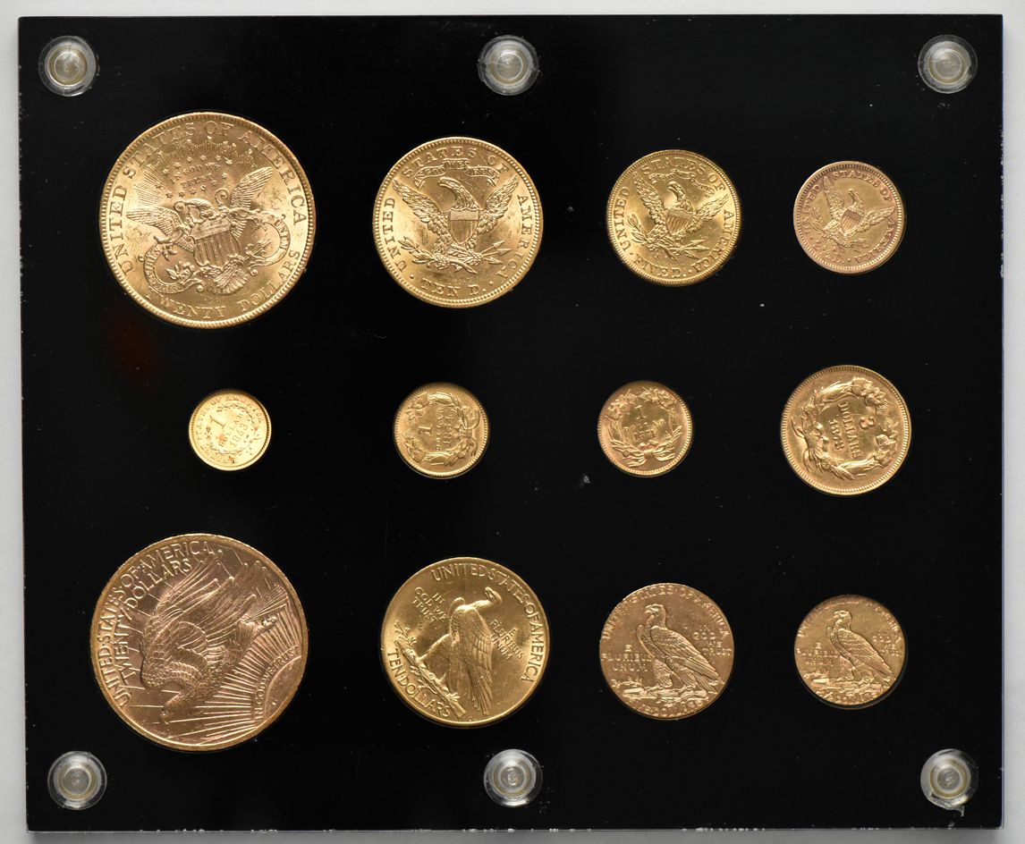 Collection of 12 gold type coins in a Capital Plastics holder