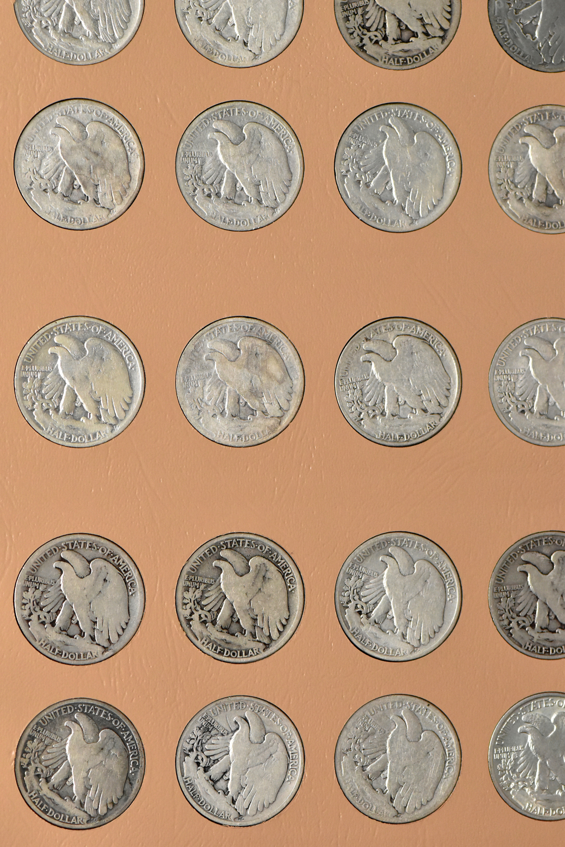Collections of Walking Liberty and Franklin half-dollars in a Dansco 7160 album