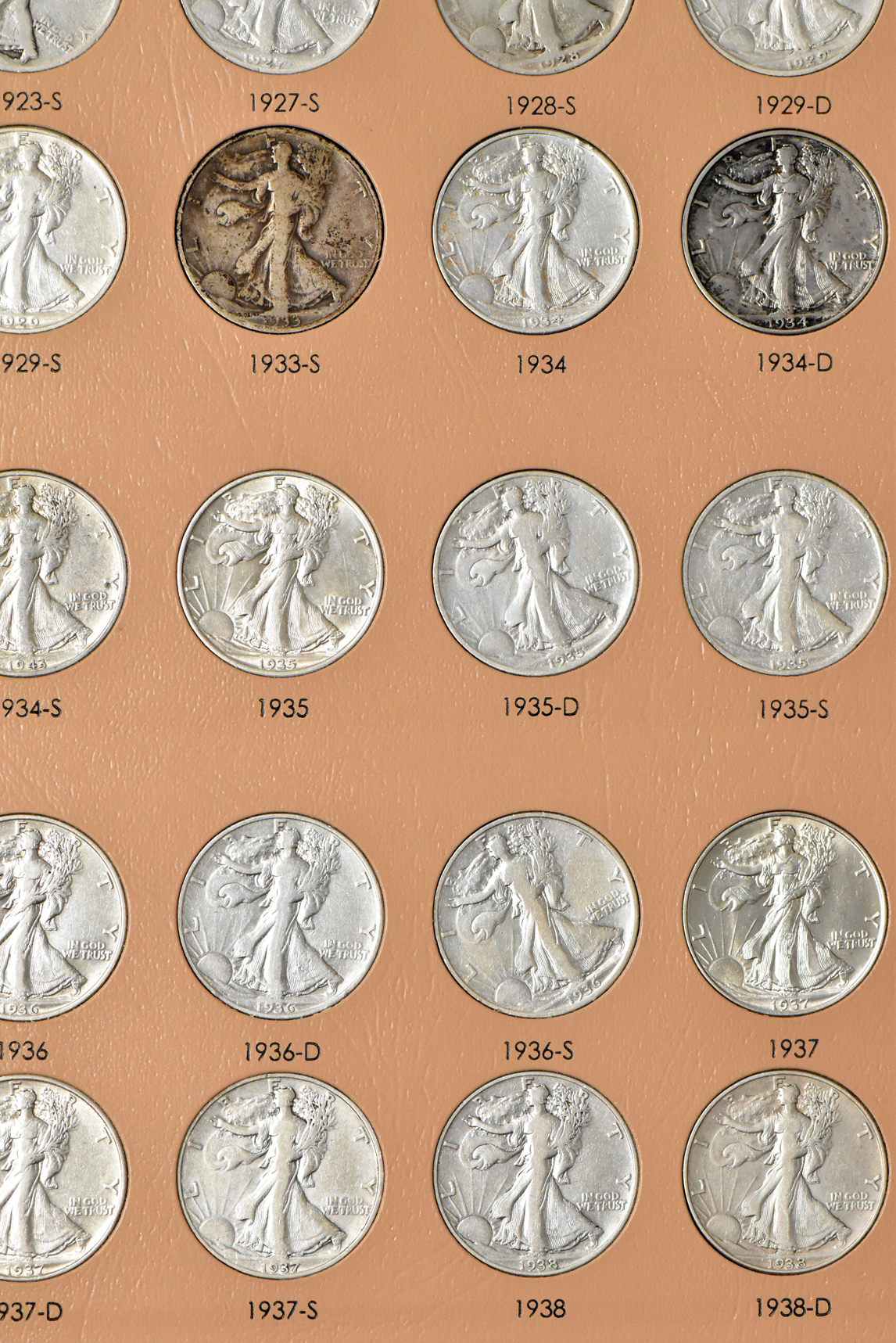 Collections of Walking Liberty and Franklin half-dollars in a Dansco 7160 album