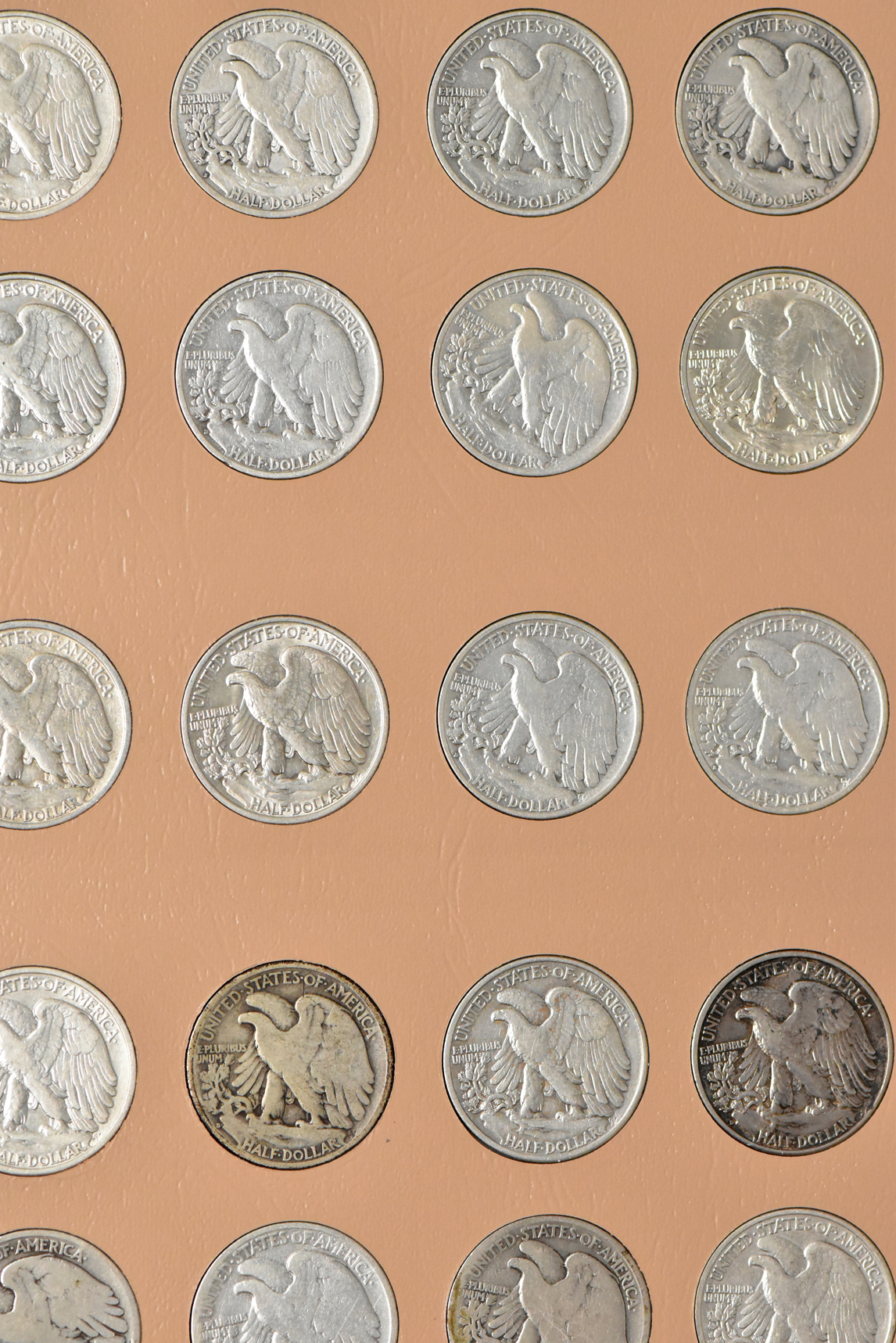 Collections of Walking Liberty and Franklin half-dollars in a Dansco 7160 album