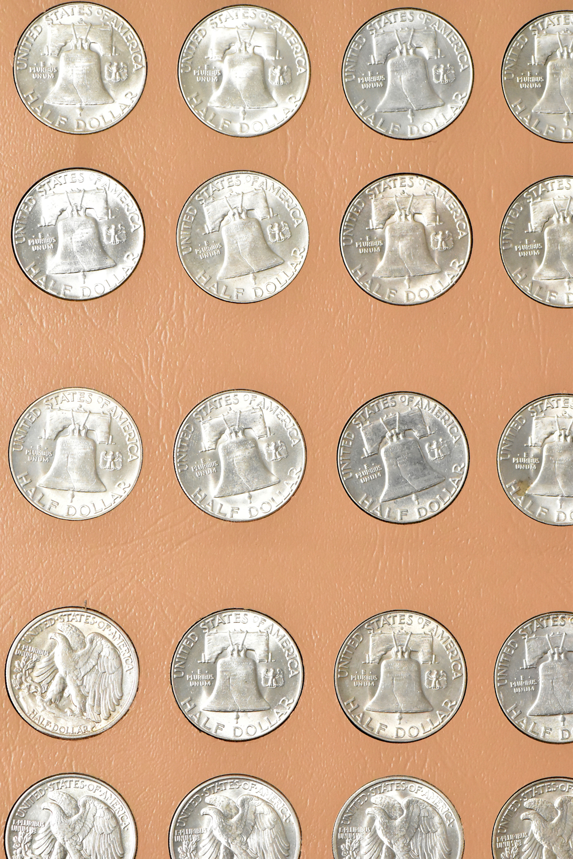 Collections of Walking Liberty and Franklin half-dollars in a Dansco 7160 album