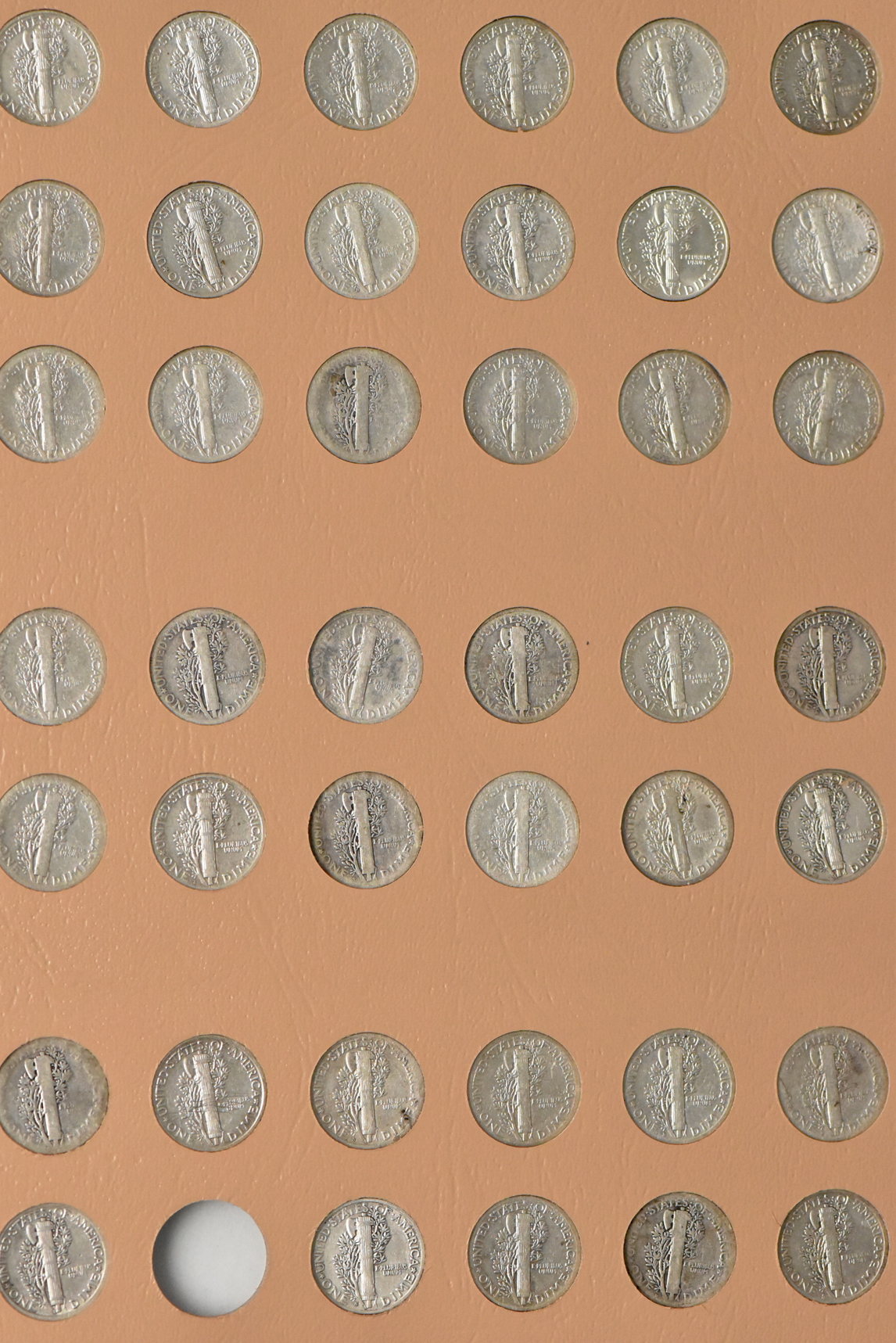 Collections of Mercury dimes and Roosevelt dimes in a Dansco album