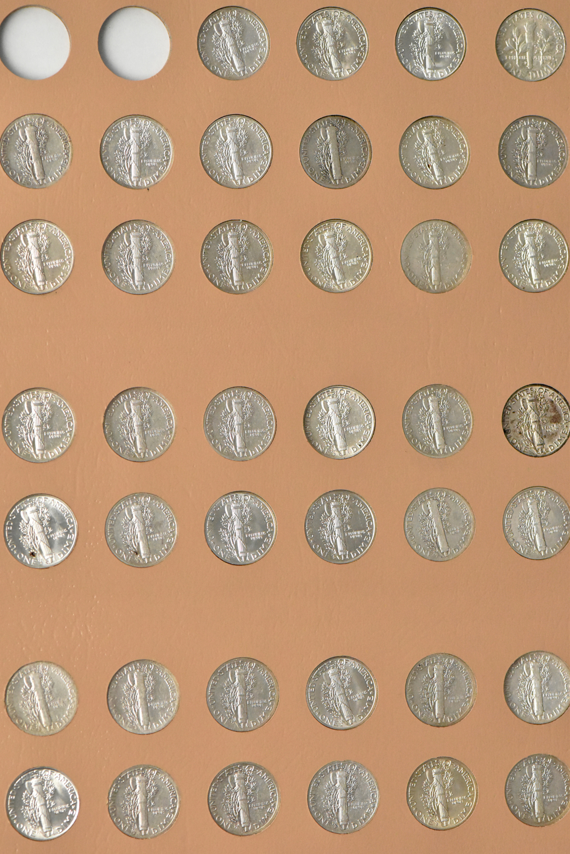 Collections of Mercury dimes and Roosevelt dimes in a Dansco album