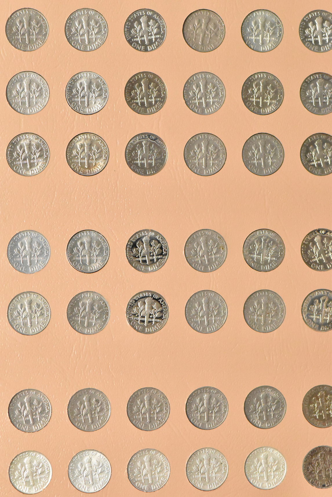 Collections of Mercury dimes and Roosevelt dimes in a Dansco album