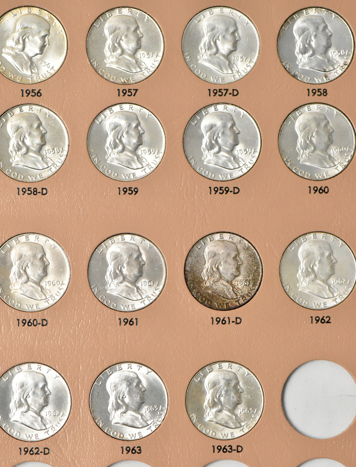 Collections of Franklin half dollars and Jefferson nickels in two Dansco albums