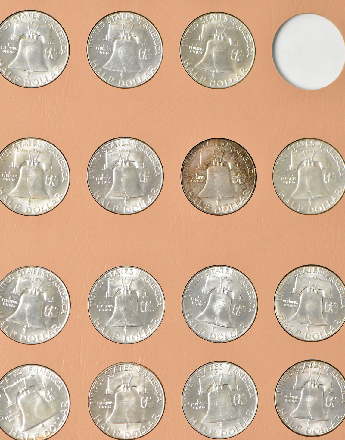 Collections of Franklin half dollars and Jefferson nickels in two Dansco albums
