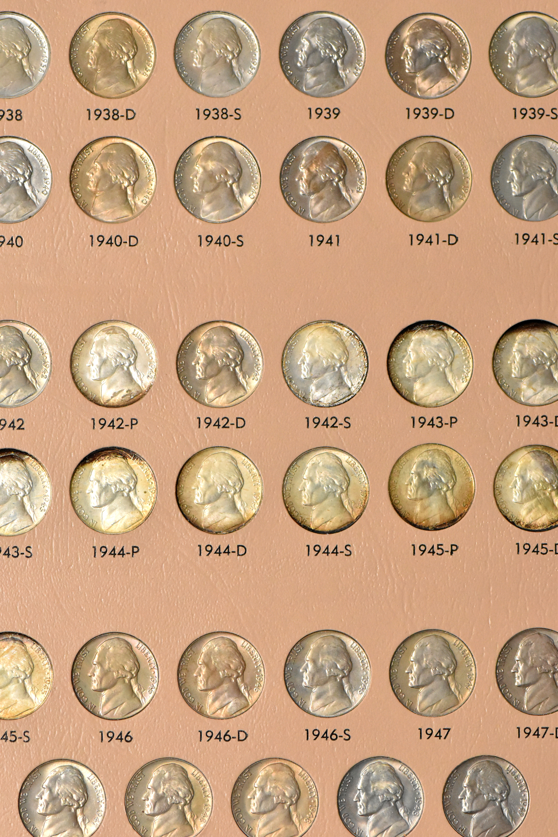 Collections of Franklin half dollars and Jefferson nickels in two Dansco albums