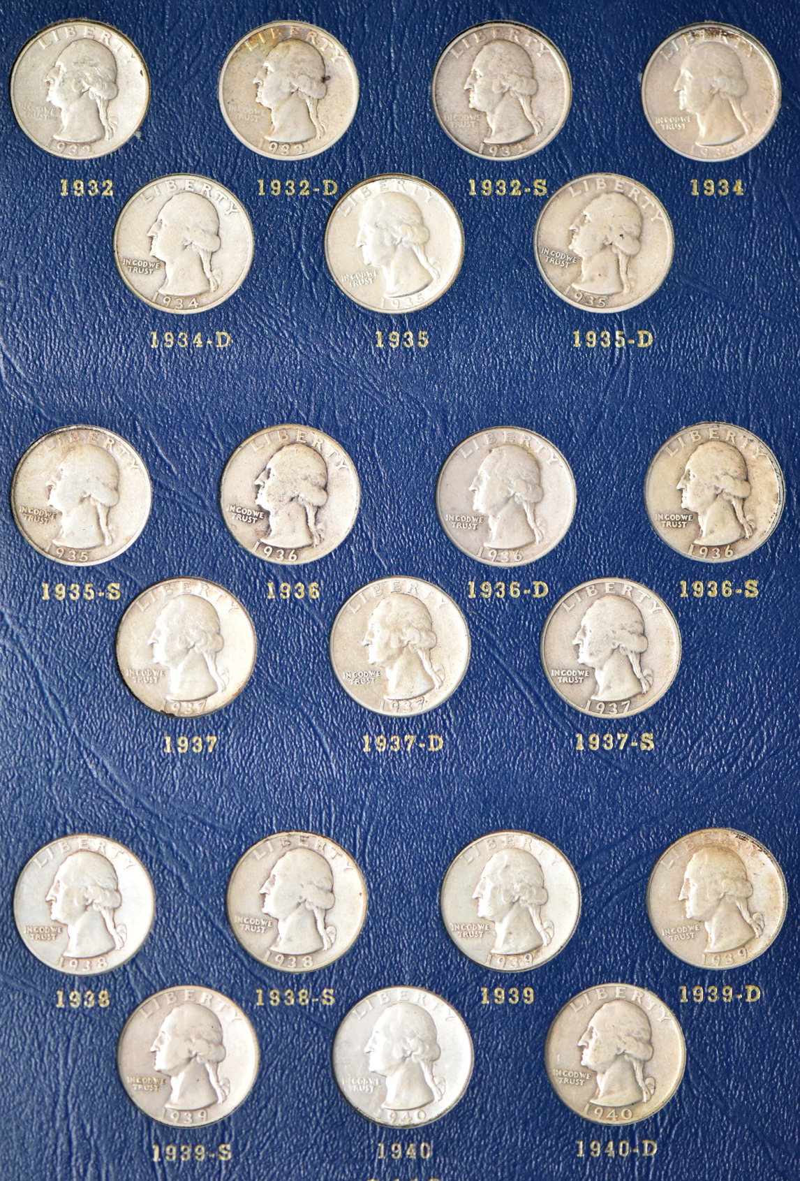 Collections of Mercury dimes, Roosevelt dimes, Washington quarters, and Franklin half dollars in four Whitman albums