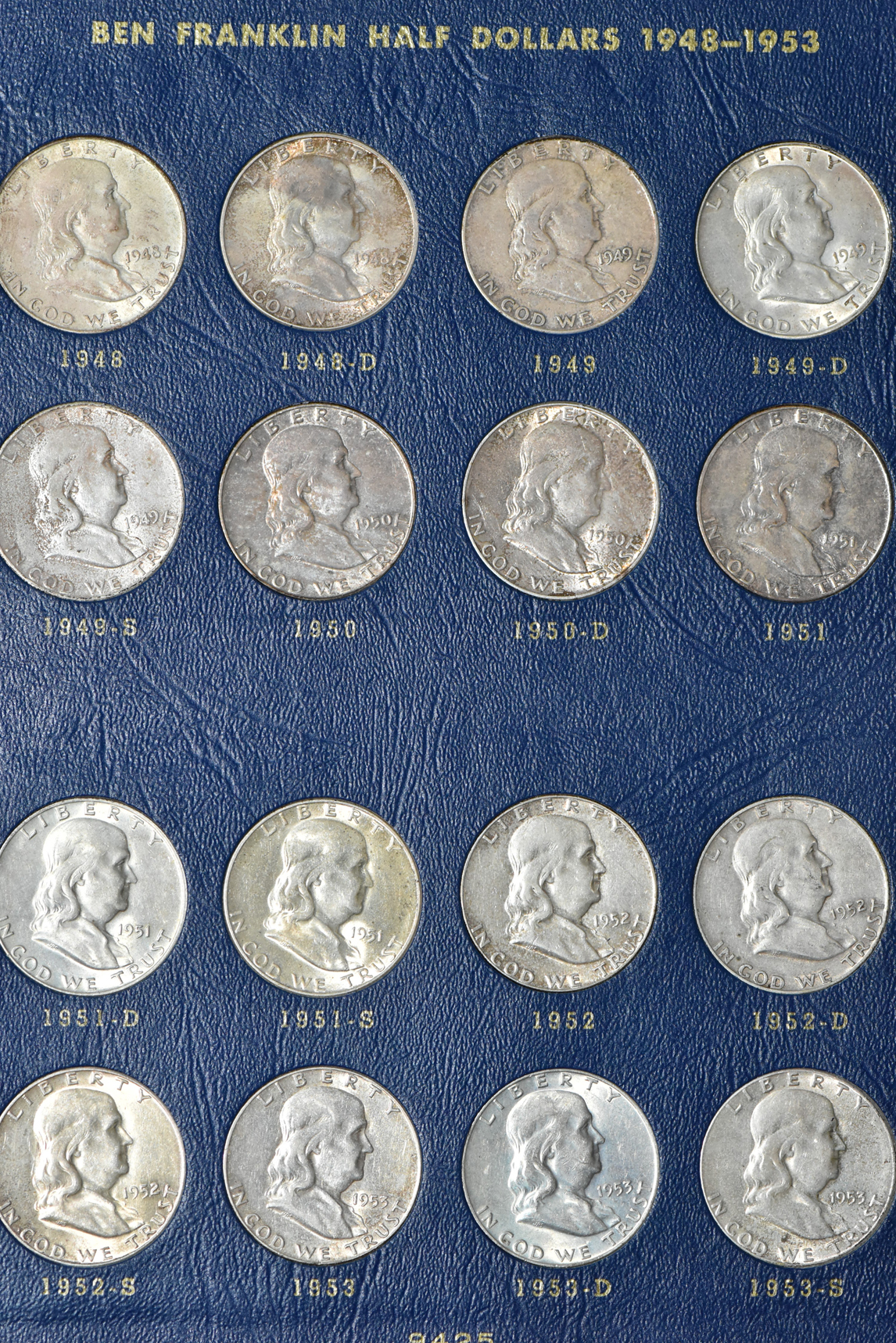 Collections of Mercury dimes, Roosevelt dimes, Washington quarters, and Franklin half dollars in four Whitman albums