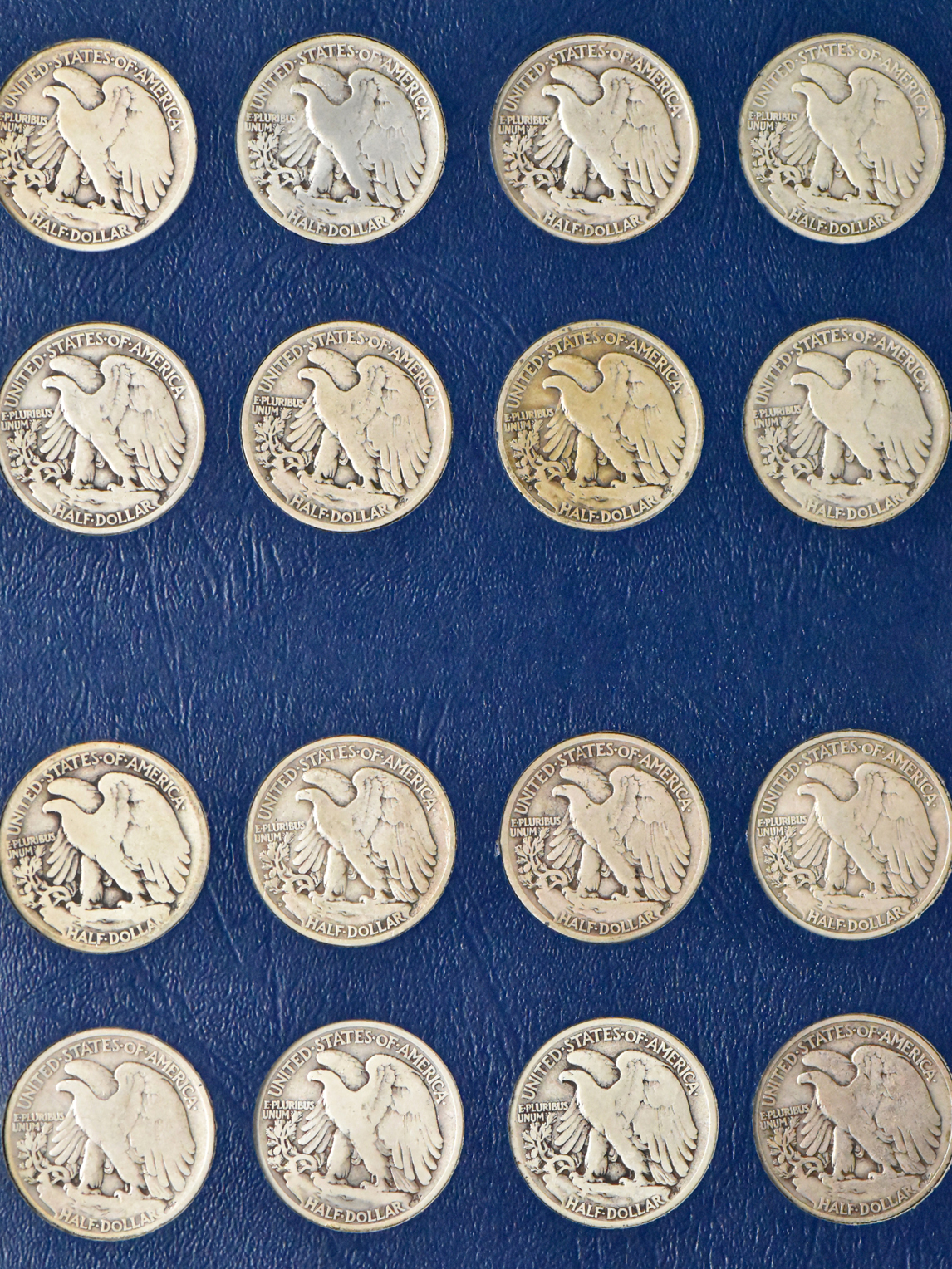 Complete collection of Walking Liberty half dollars in two Whitman albums