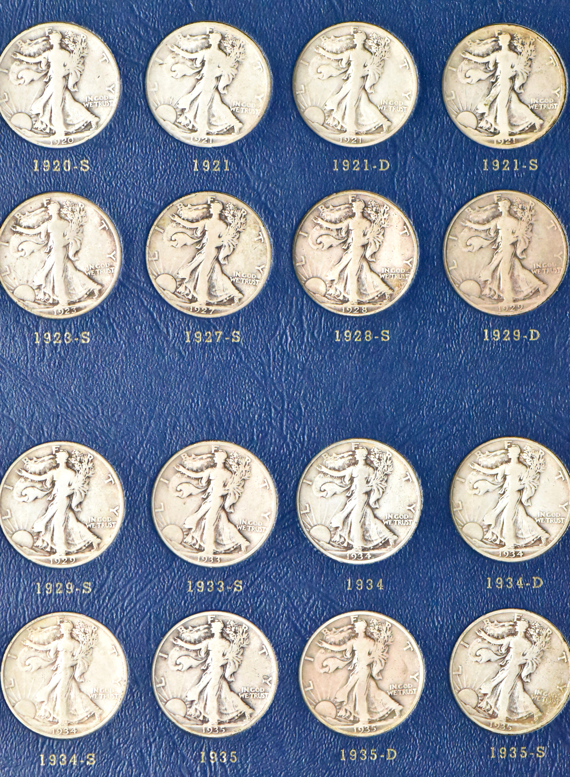 Complete collection of Walking Liberty half dollars in two Whitman albums