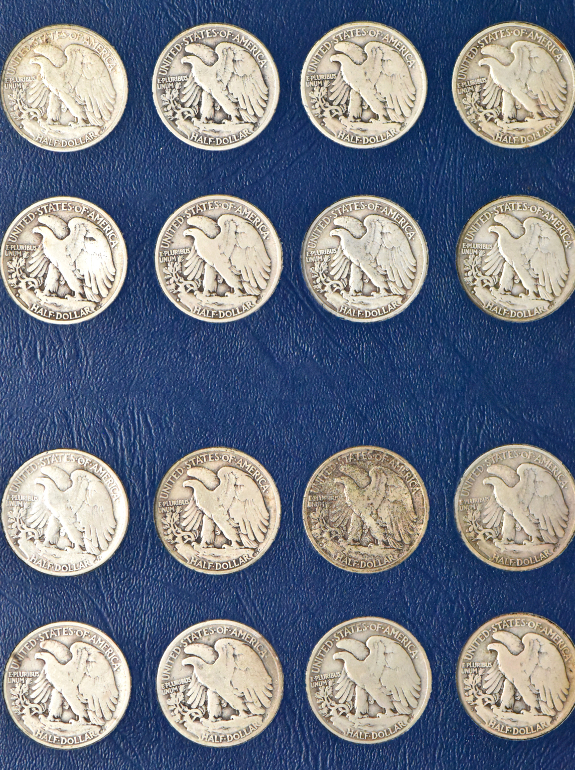 Complete collection of Walking Liberty half dollars in two Whitman albums