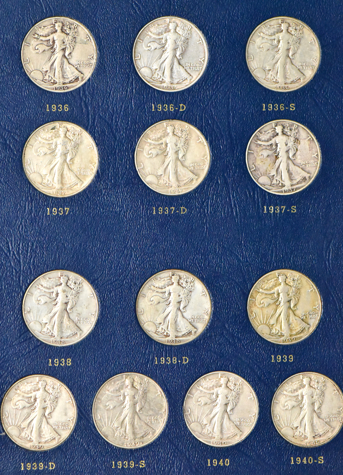Complete collection of Walking Liberty half dollars in two Whitman albums