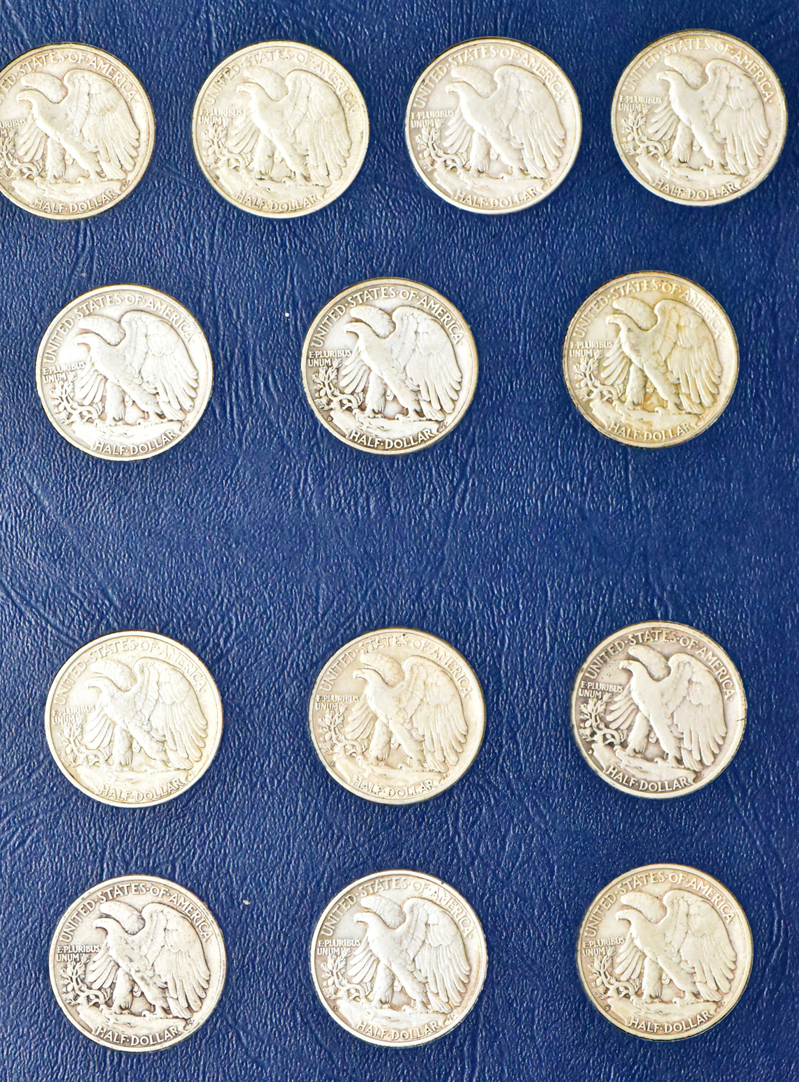 Complete collection of Walking Liberty half dollars in two Whitman albums
