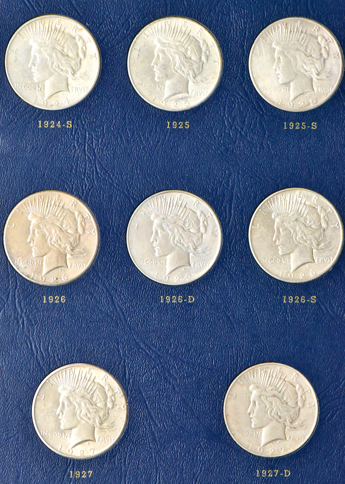 Collection of Peace dollars in a complete Whitman 9430