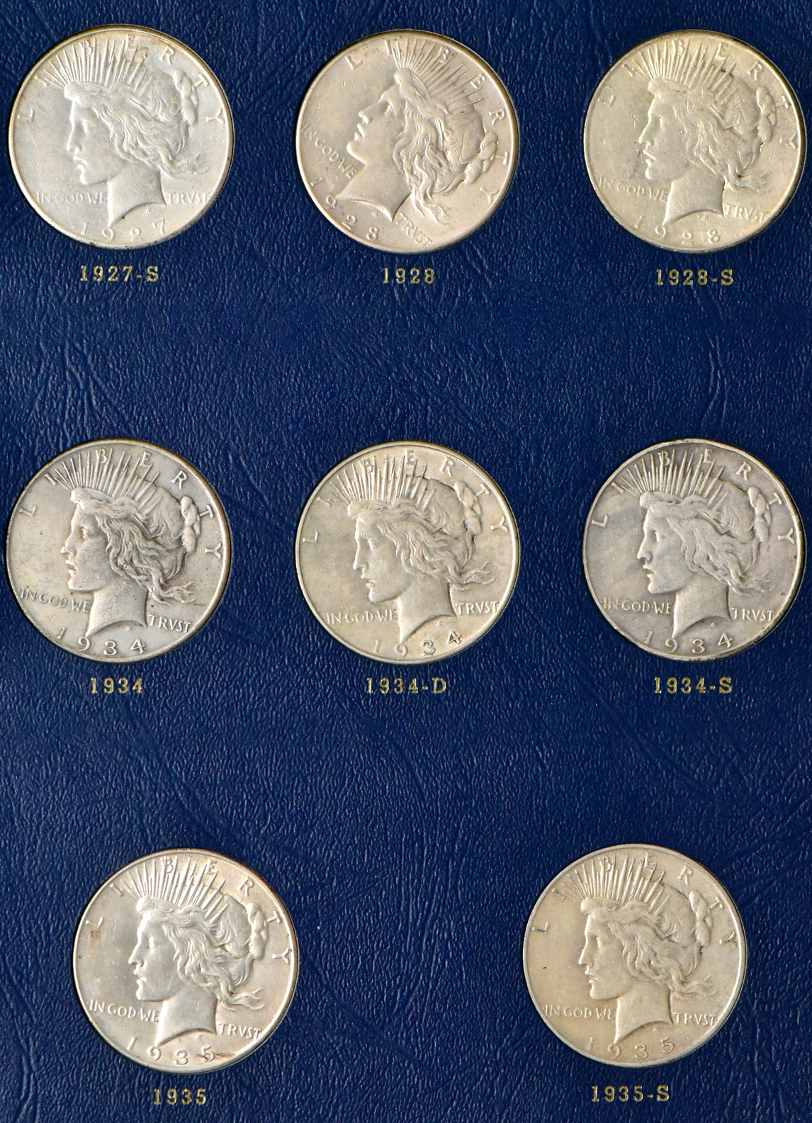 Collection of Peace dollars in a complete Whitman 9430