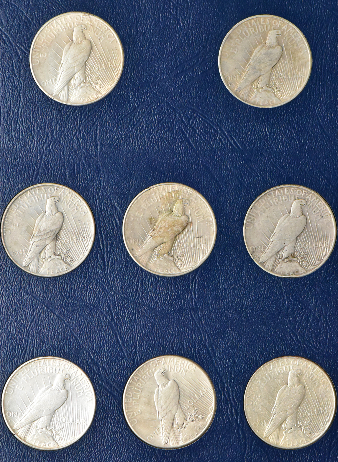 Collection of Peace dollars in a complete Whitman 9430