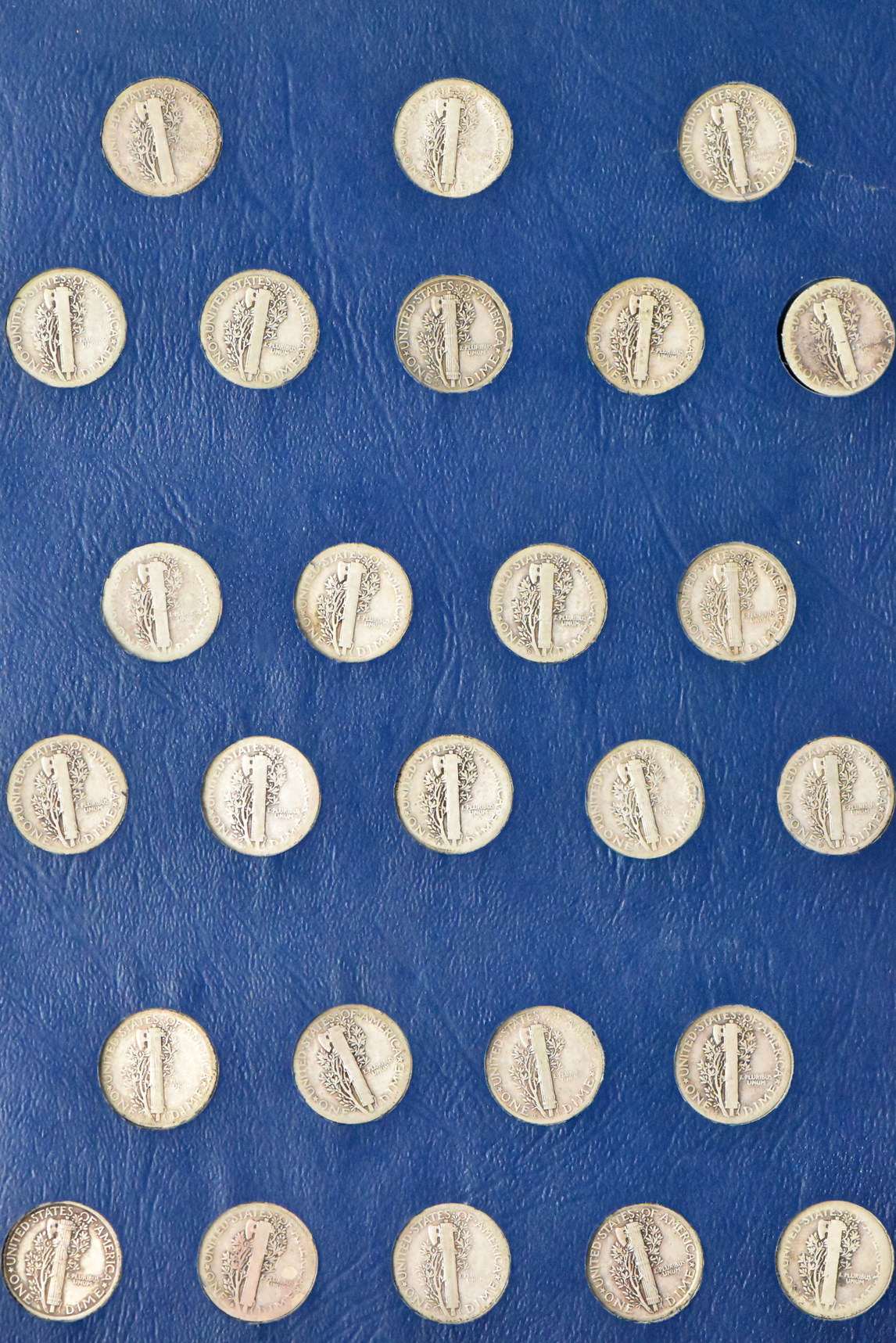 Collection of Mercury dimes in a Whitman 9413 album