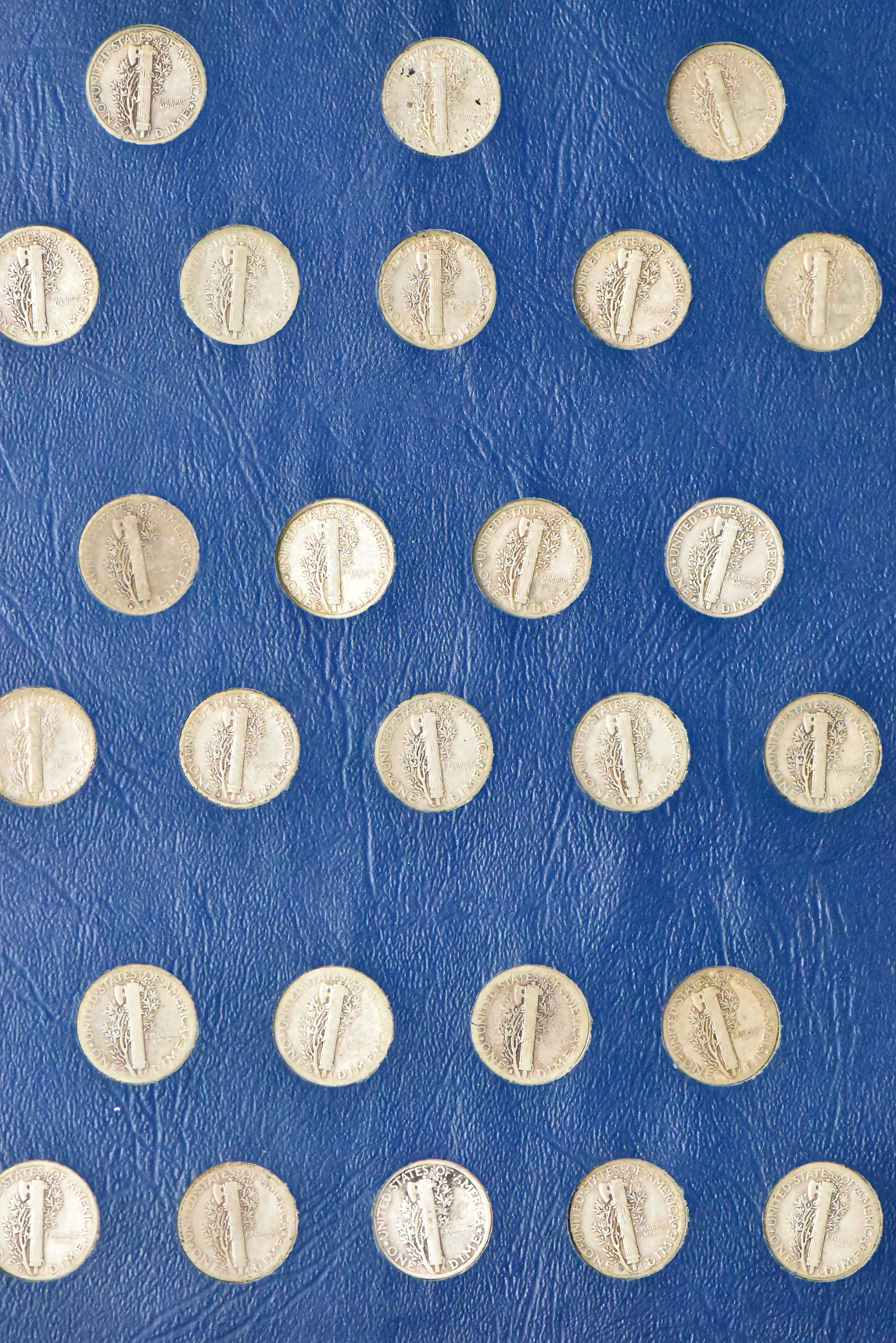 Collection of Mercury dimes in a Whitman 9413 album