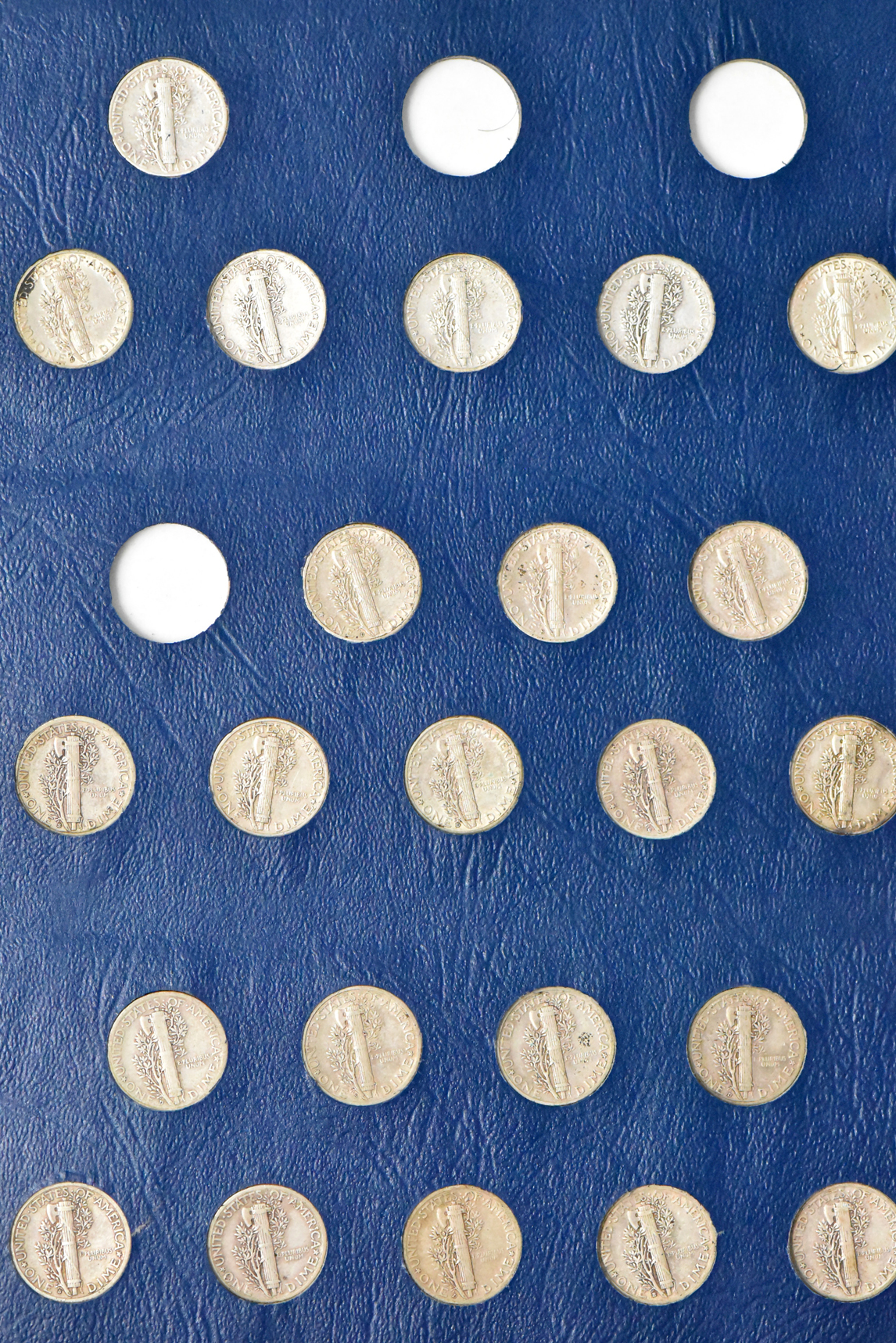 Collection of Mercury dimes in a Whitman 9413 album