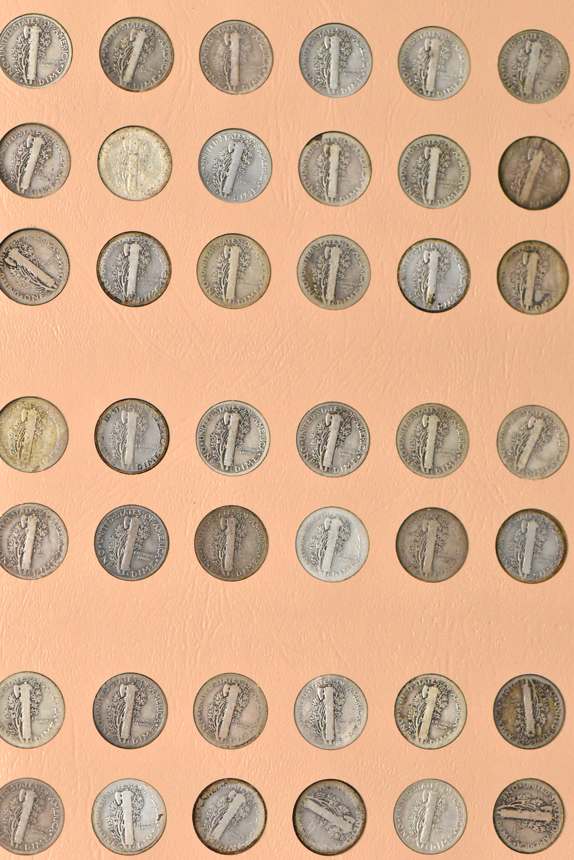 Complete collection of Mercury dimes in a Dansco 7123 album