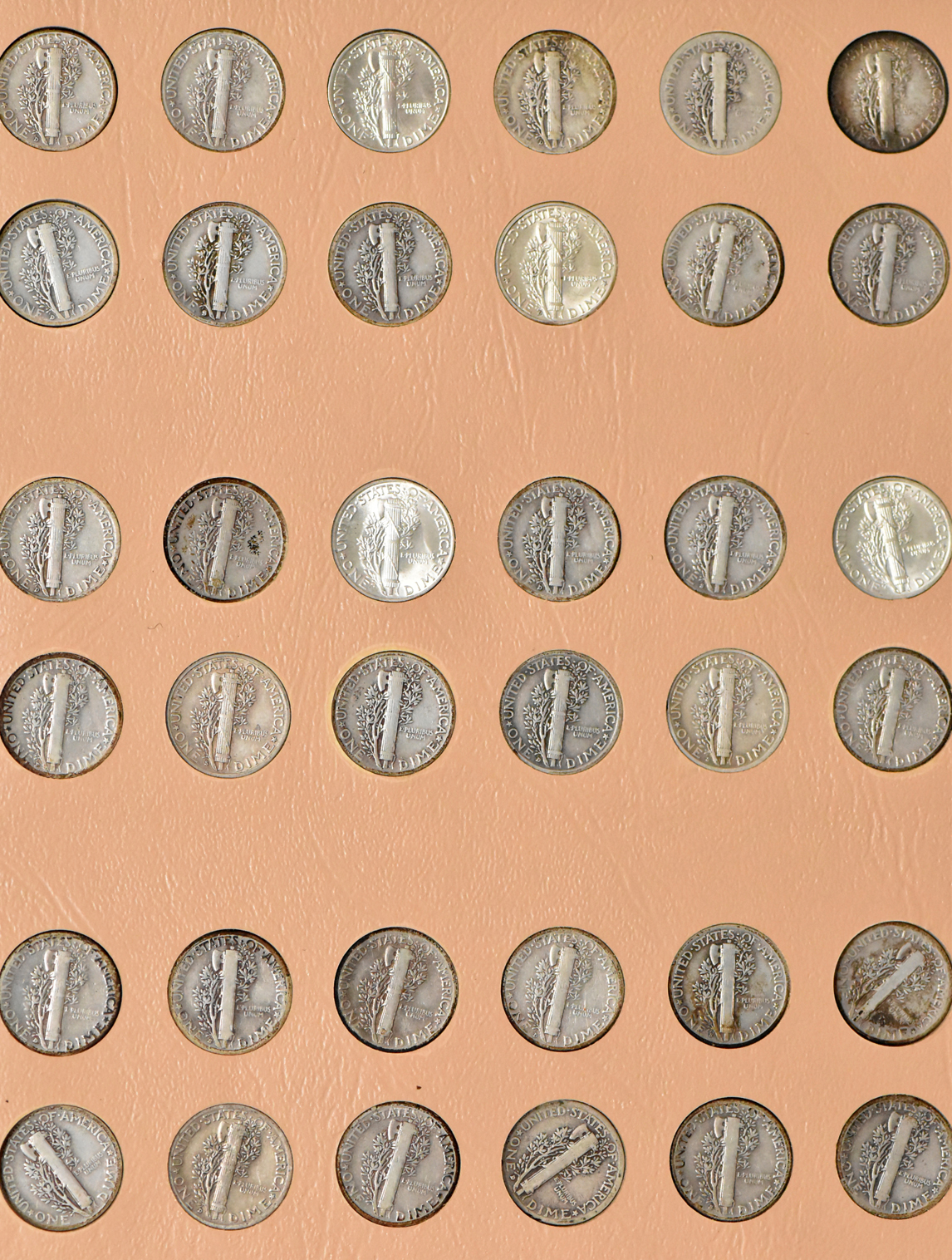 Complete collection of Mercury dimes in a Dansco 7123 album