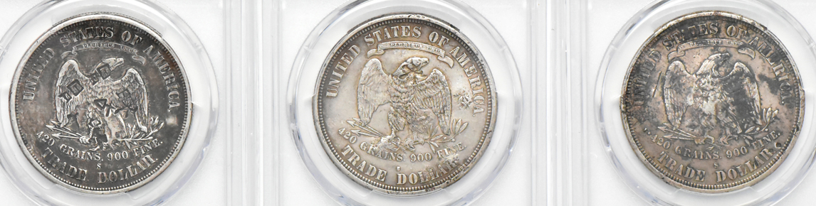 Six chopmarked Trade dollars, plus an 1884-CC Morgan dollar MS-65 (green label), all PCGS