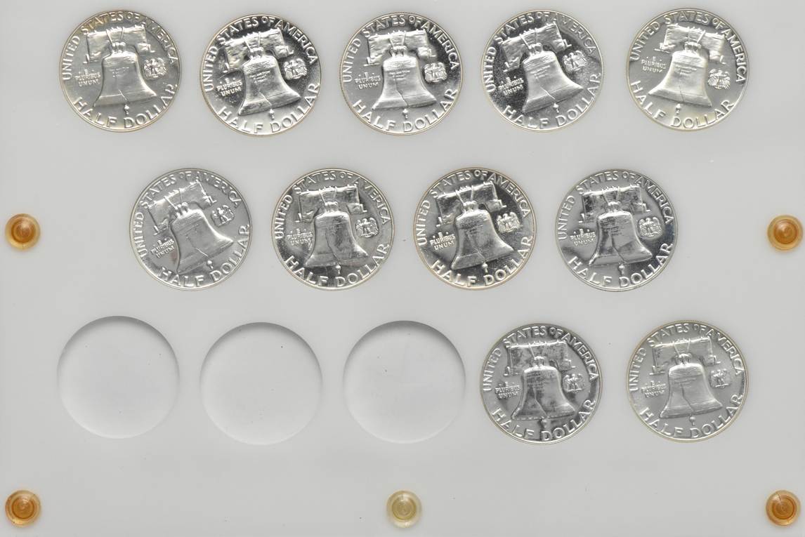 Group of Proof silver Washington quarters and Franklin half dollars in two Capital Plastics holders