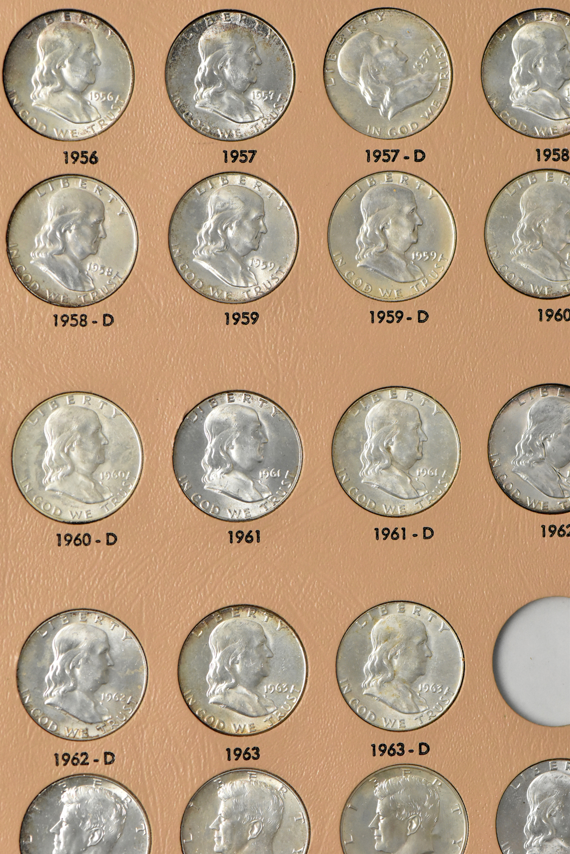 Collection of Franklin half dollars in a complete Dansco 7165 album (plus an additional 1963 and three 1964 Kennedy half dollars)