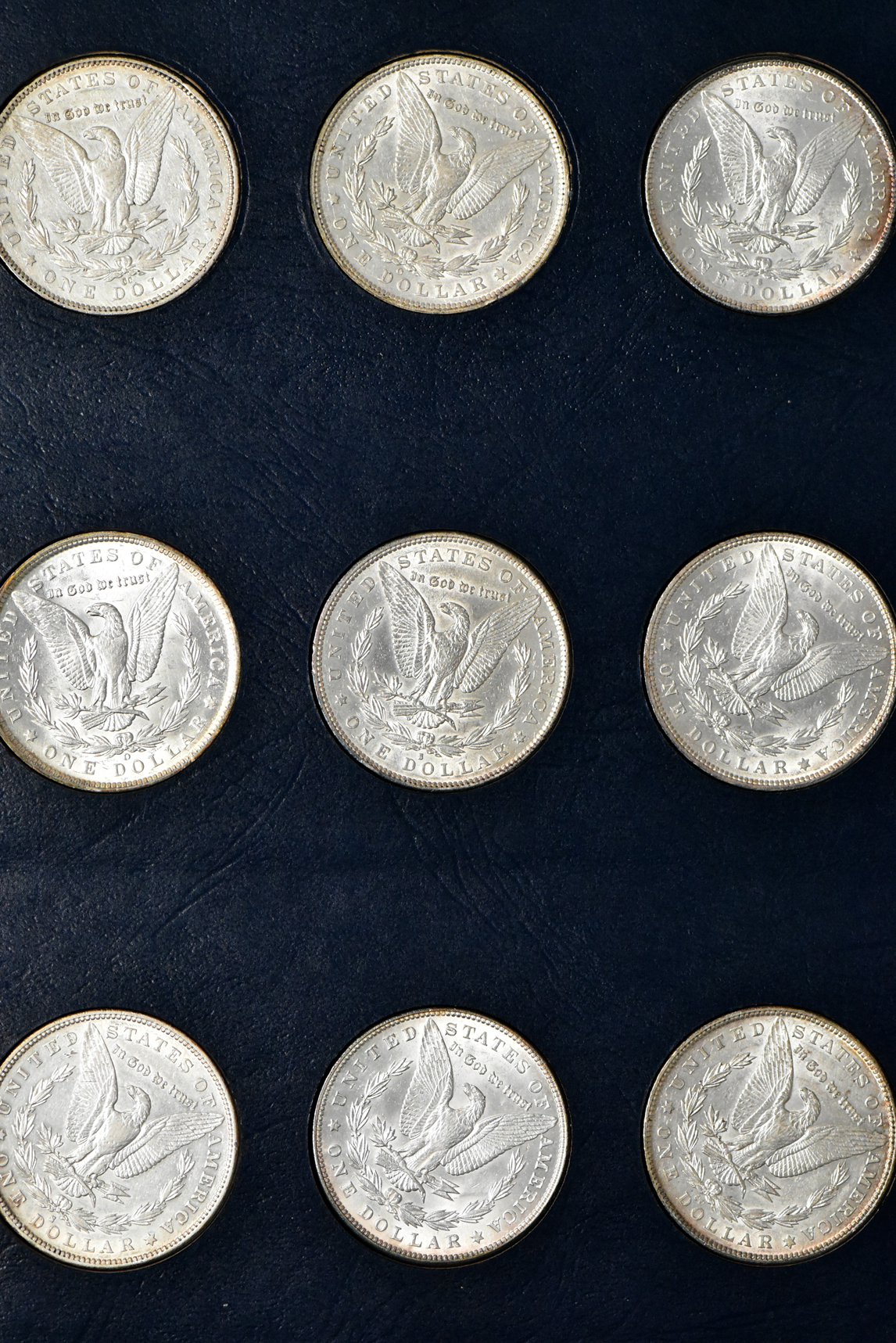 Collection of 44 different Morgan dollars in a Whitman 9128 album