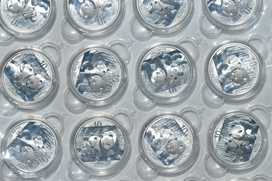 China - Fifty-four 2010 1oz silver Panda 10 yuan in capsules