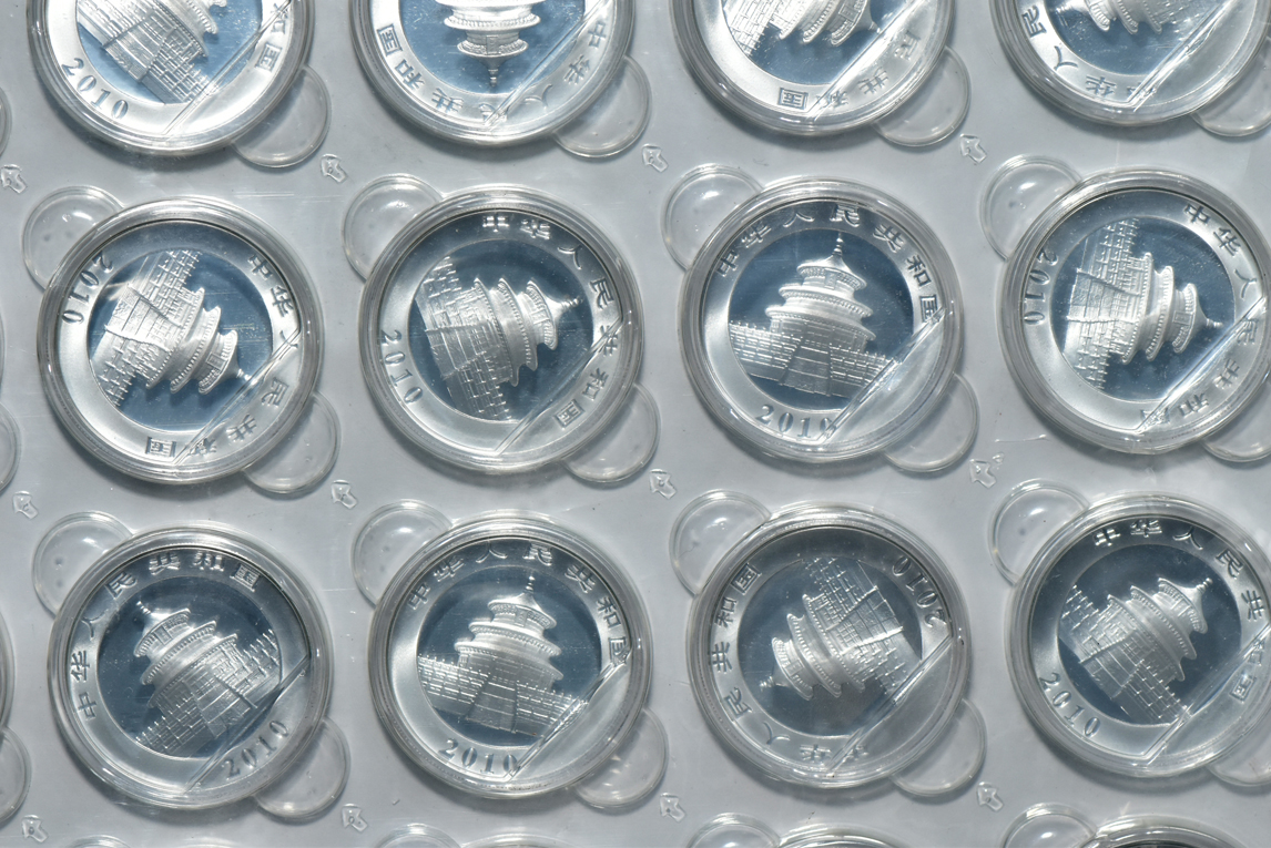 China - Fifty-four 2010 1oz silver Panda 10 yuan in capsules