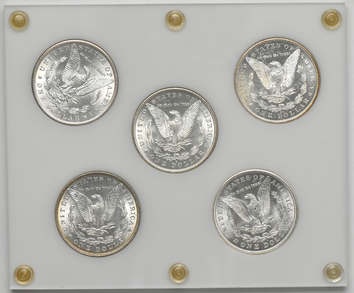 Five Uncirculated Morgan dollars representing "All Mints" in a Capital Plastics holder