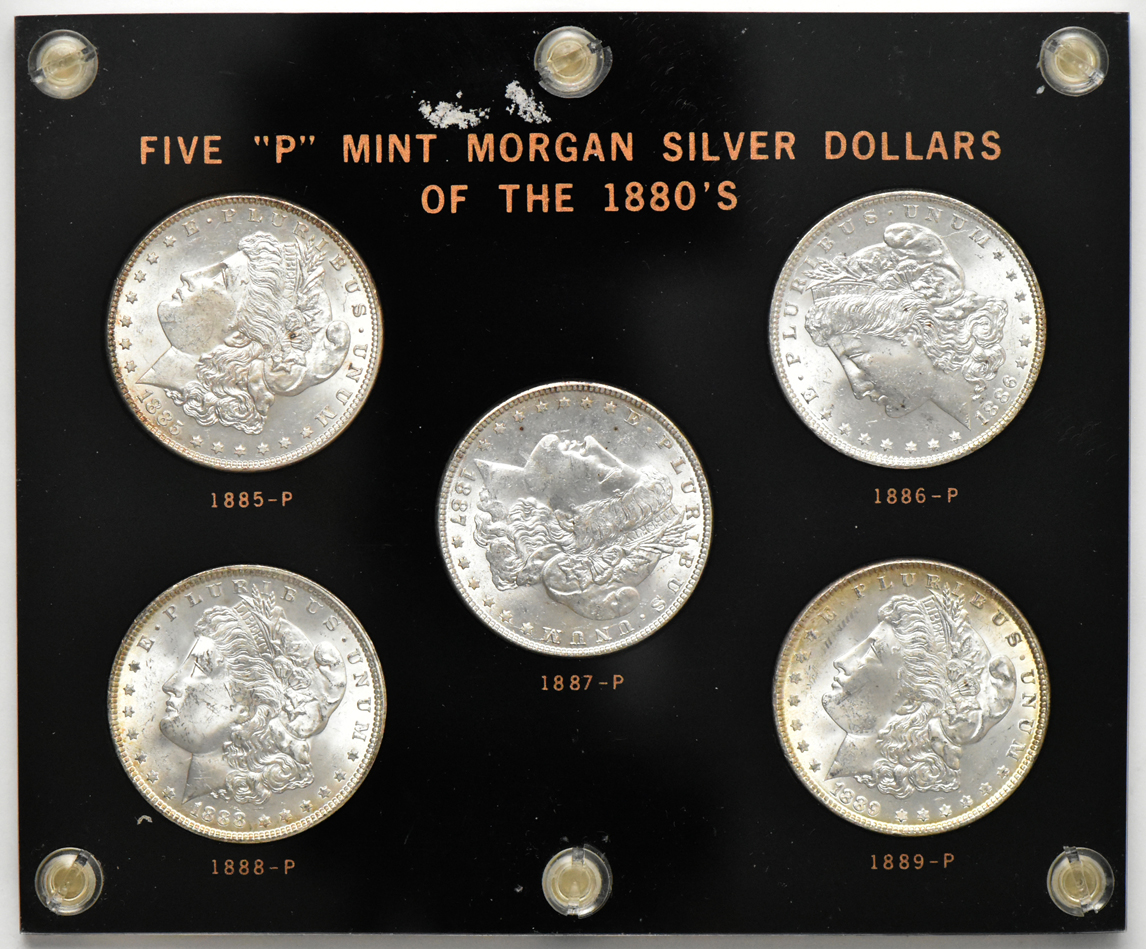 Ten Morgan dollars in two Capital Plastics holders