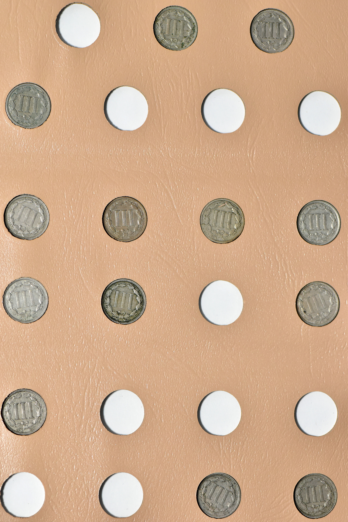 Collection of two-cent pieces and nickel three-cent pieces in a Dansco album