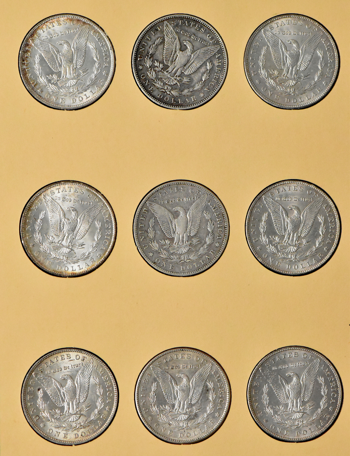 Collection of 27 Morgan dollars, 1897-O through 1921-S, plus an extra 1921, in a Library of Coin Vol. 25 album