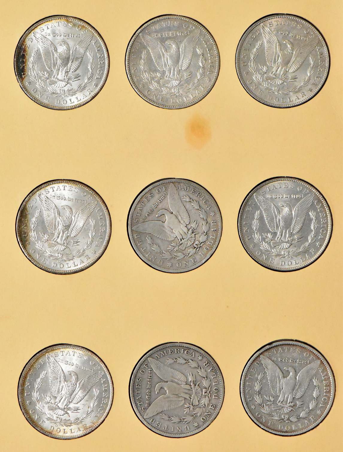 Collection of 27 Morgan dollars, 1897-O through 1921-S, plus an extra 1921, in a Library of Coin Vol. 25 album