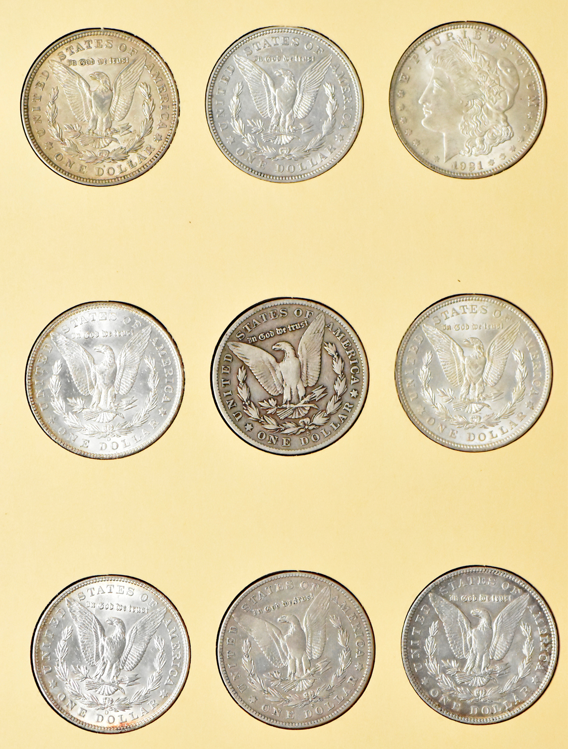 Collection of 27 Morgan dollars, 1897-O through 1921-S, plus an extra 1921, in a Library of Coin Vol. 25 album