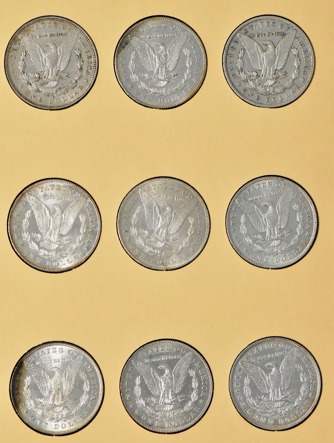 Group of 35 different Morgan dollars in Library of Coin Vol. 23 album