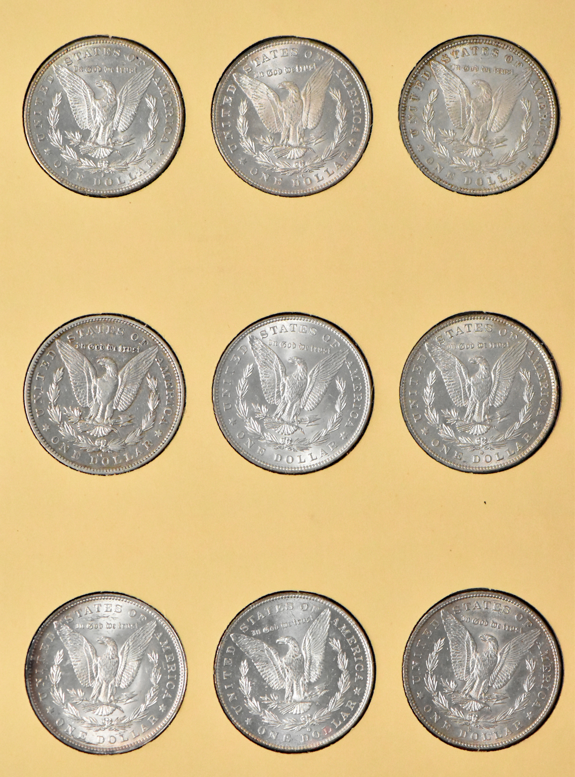Group of 35 different Morgan dollars in Library of Coin Vol. 23 album