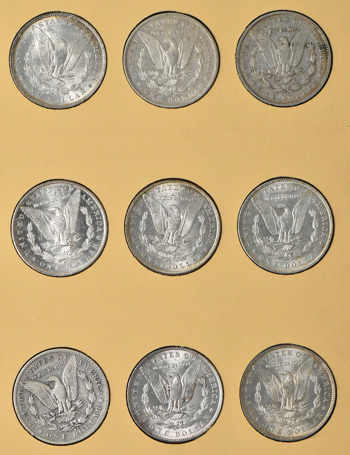 Collection of 36 Morgan dollars, 1887 through 1897, in a Library of Coins Vol. 24 album