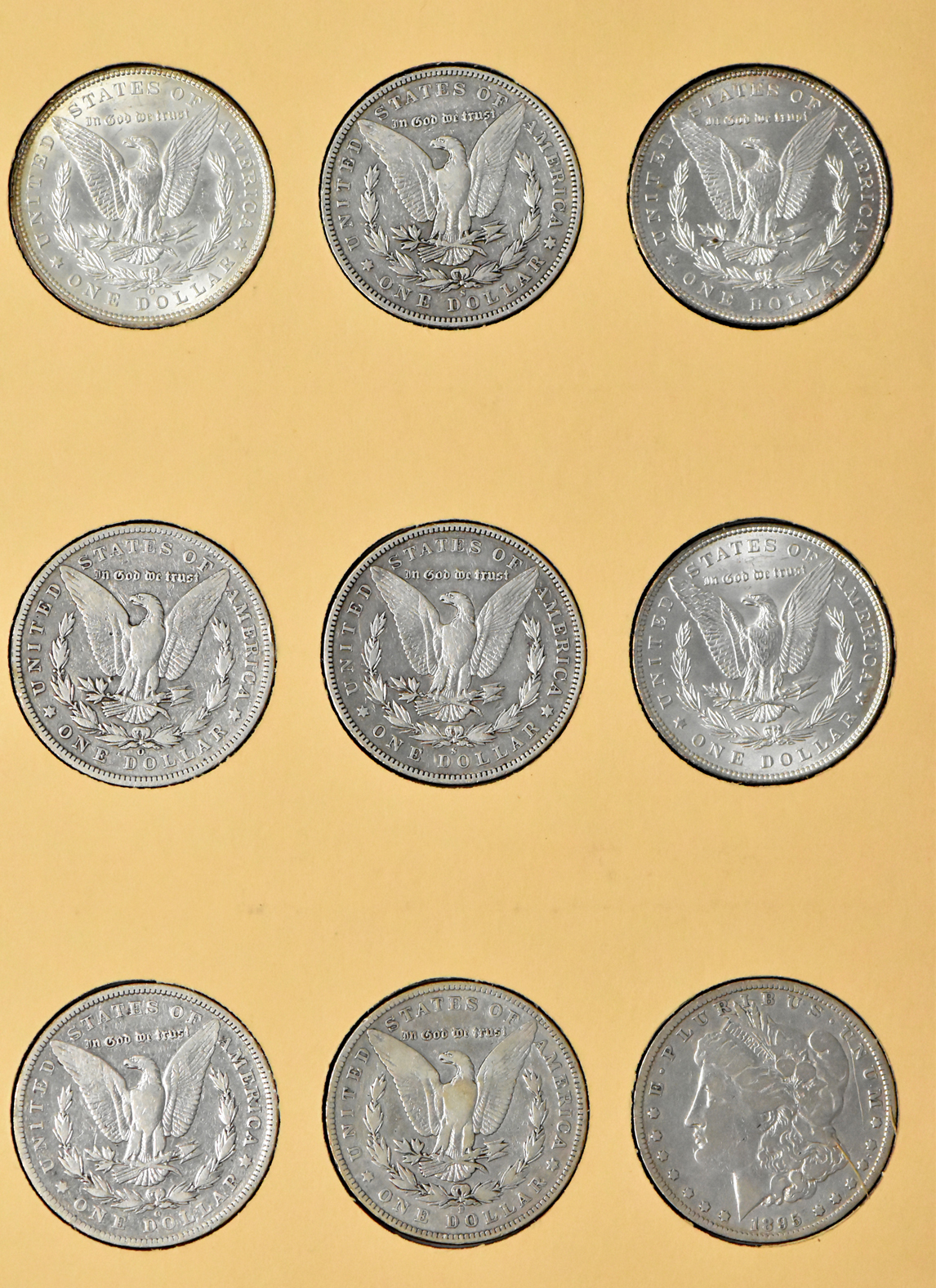 Collection of 36 Morgan dollars, 1887 through 1897, in a Library of Coins Vol. 24 album