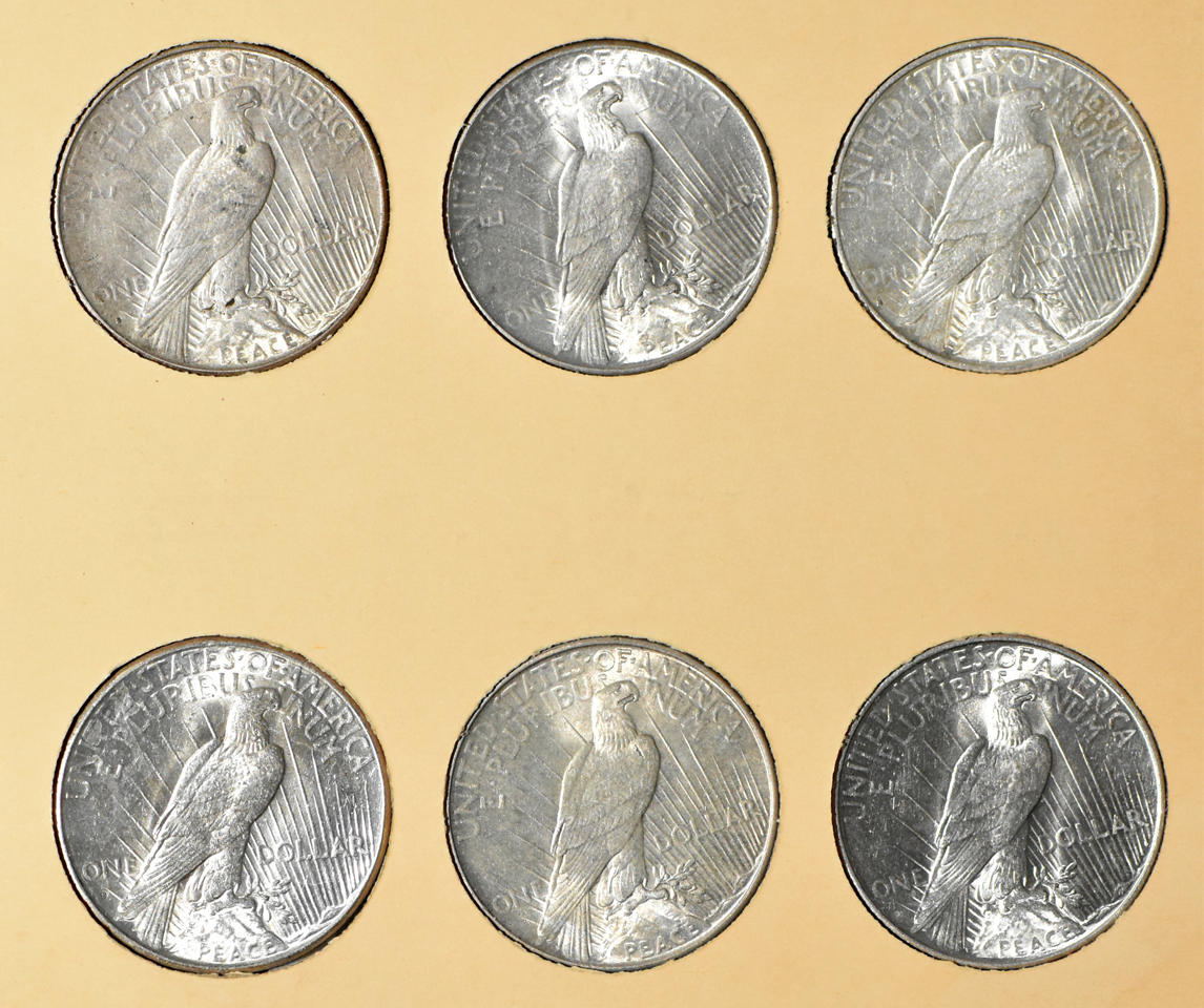 Collection of 24 Peace dollars in a complete Library of Coins Vol. 26 album