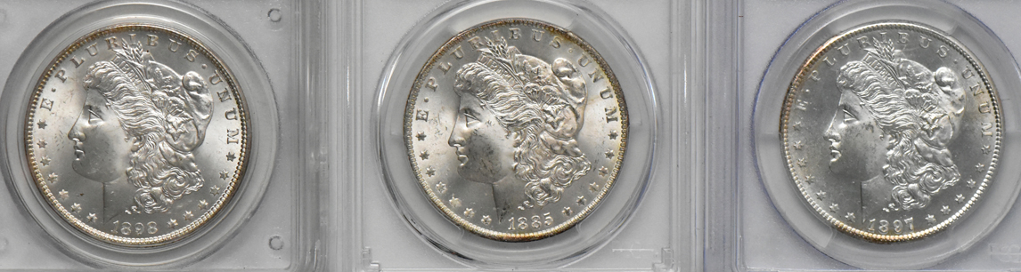 Five GEM Morgan dollars, all PCGS