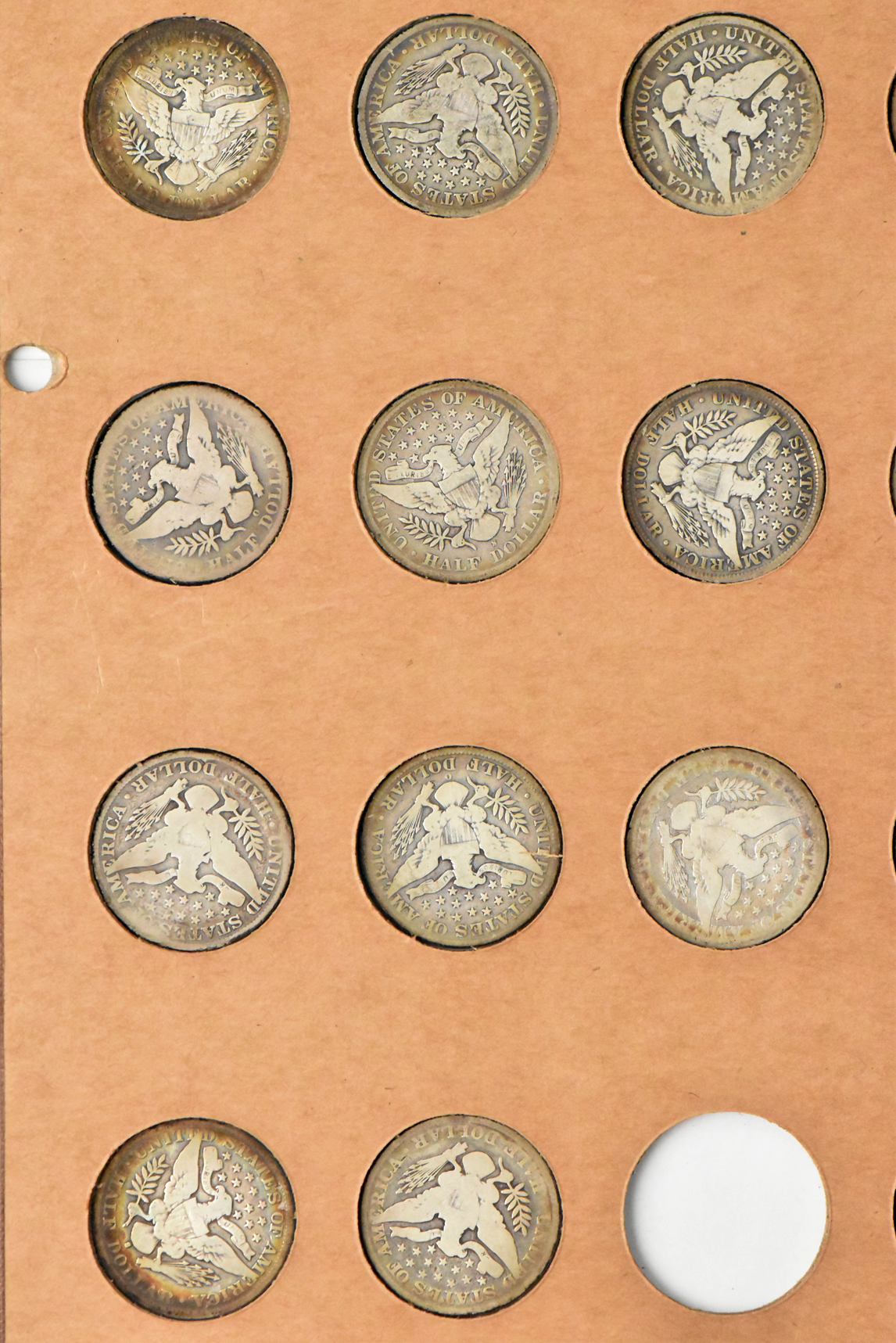 Collection of 47 different Barber half dollars in a The National Coin Album