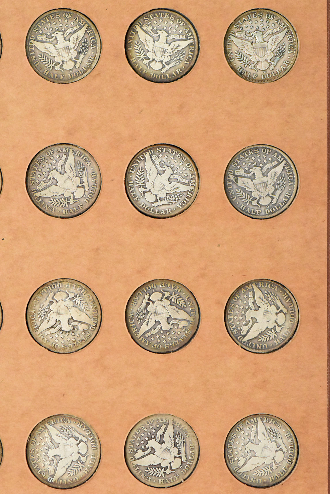 Collection of 47 different Barber half dollars in a The National Coin Album