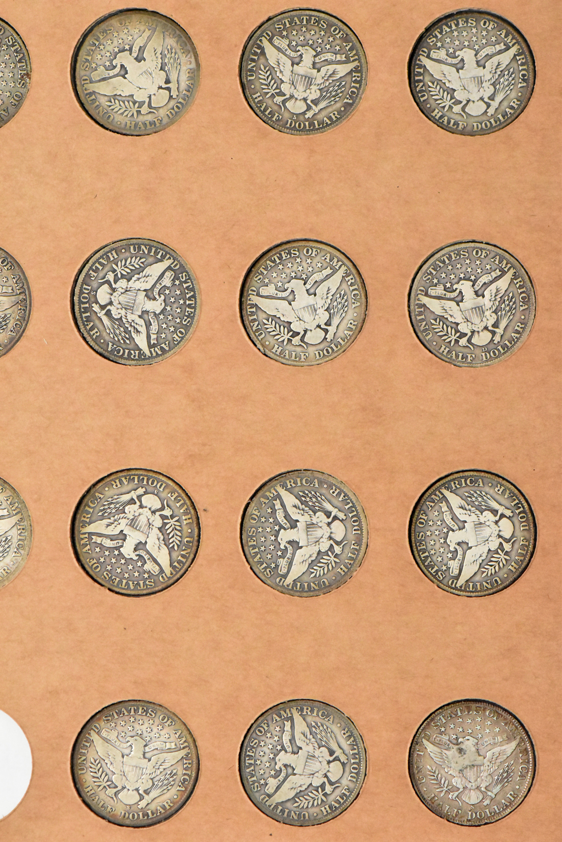 Collection of 47 different Barber half dollars in a The National Coin Album