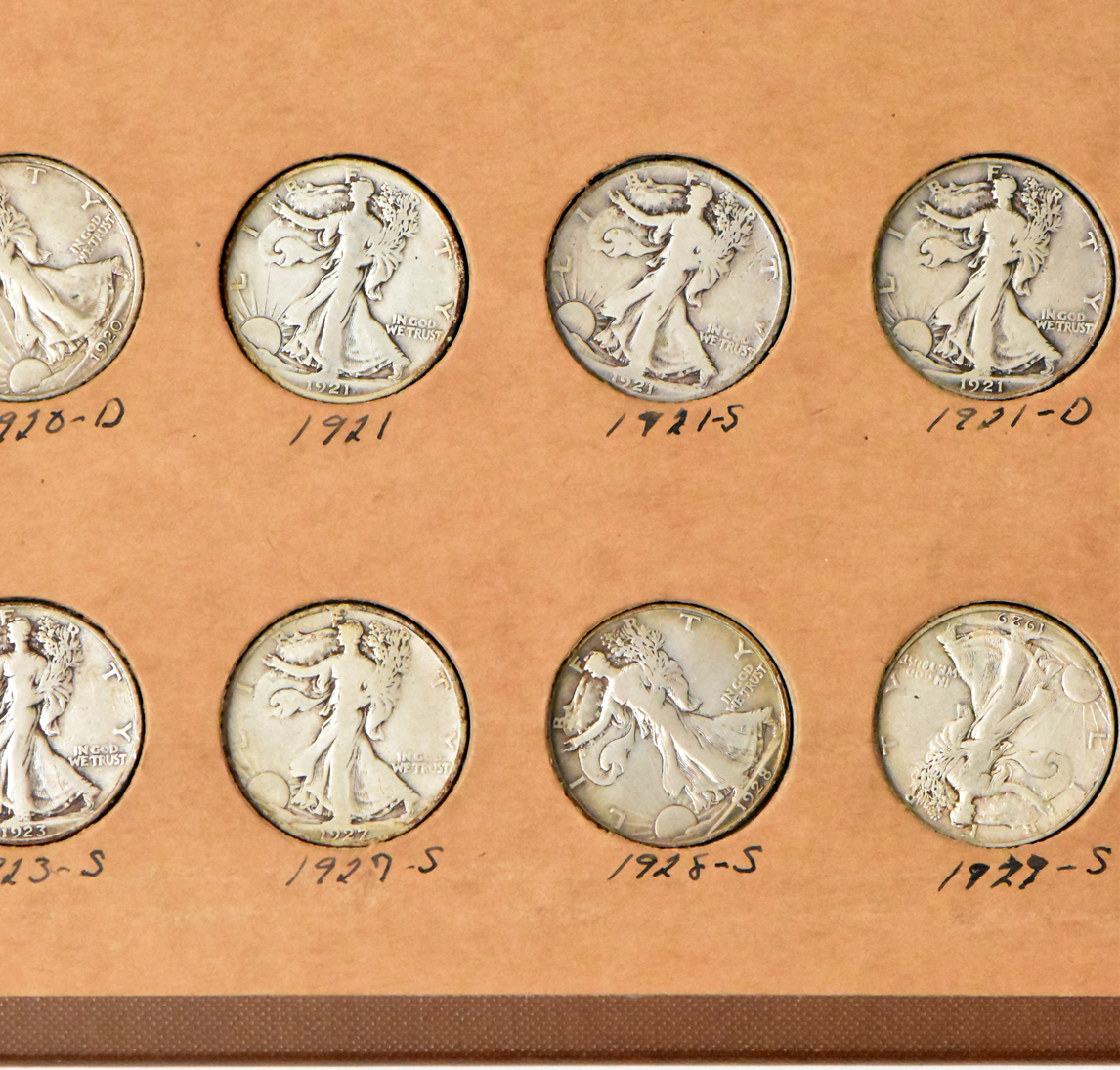 Collection of 58 different Walking Liberty half dollars and 27 Franklin half dollars in a The National Coin Album