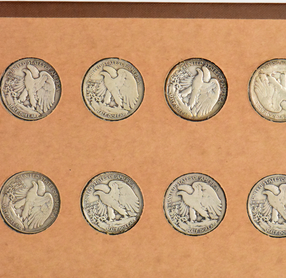 Collection of 58 different Walking Liberty half dollars and 27 Franklin half dollars in a The National Coin Album