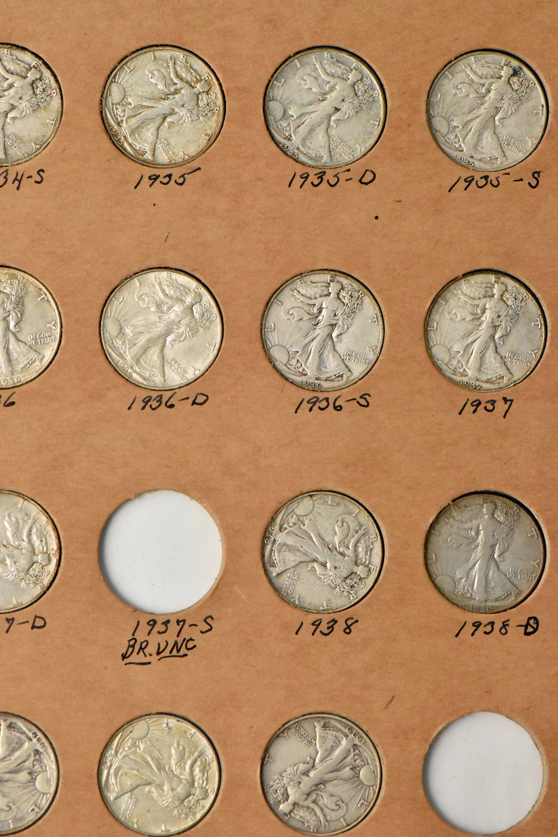 Collection of 58 different Walking Liberty half dollars and 27 Franklin half dollars in a The National Coin Album